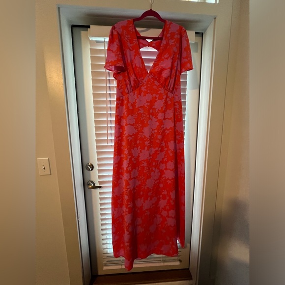 Maxi length dress. Never worn. Cut out back. Orange and pink floral design. - Picture 1 of 5